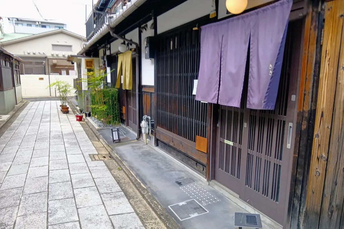 Entrance of Kikyo-An, with a purple noren and lattice doors