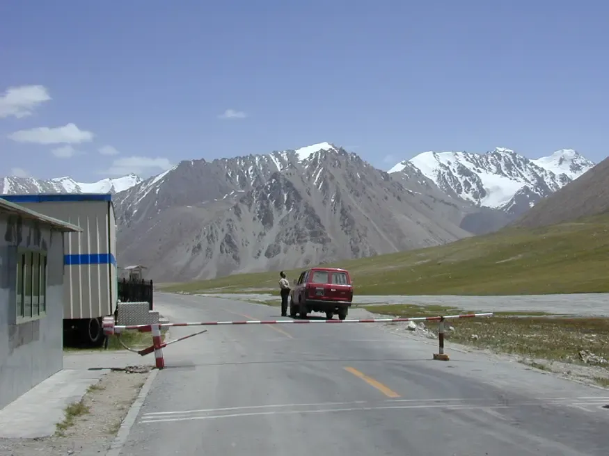 The road and snow mountains leading to the Pakistan–China border at Khunjerab Pass